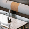 Atlas Booth commercial banquette seating with upholstered backrest and timber base for hospitality interiors