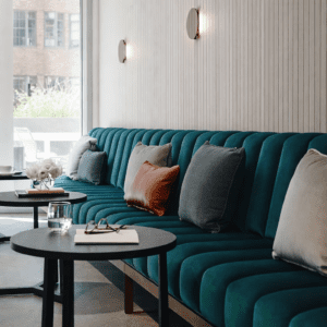 Custom upholstered banquette seating in a modern hospitality interior, Australian made commercial furniture
