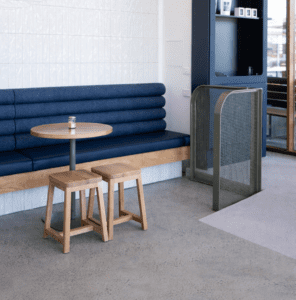 Log Booth commercial banquette seating with upholstered backrest and timber base in hospitality interior
