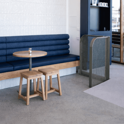 Log Booth commercial banquette seating with upholstered backrest and timber base in hospitality interior