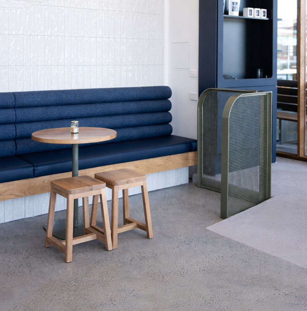Log Booth commercial banquette seating with upholstered backrest and timber base in hospitality interior