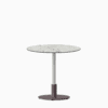 Round dining table with compact‑laminate top and metal pedestal base.