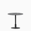 Round dining table with compact‑laminate top and metal pedestal base.