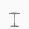Round dining table with compact‑laminate top and metal pedestal base.