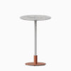 Round bar table with marble top and metal pedestal base.