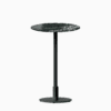 Round bar table with marble top and metal pedestal base.