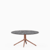 Round dining table with compact‑laminate top and aluminium base