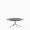 Round dining table with compact‑laminate top and aluminium base