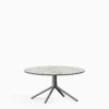 Round dining table with compact‑laminate top and aluminium base