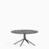 Round dining table with compact‑laminate top and aluminium base