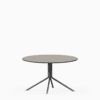 Round compact‑laminate coffee table with aluminium base.