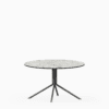 Round compact‑laminate coffee table with aluminium base.