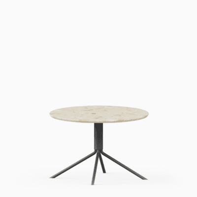 Round terrazzo table with speckled stone top and green aluminium base.