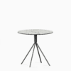 Round compact‑laminate dining table with aluminium base.