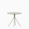 Round compact‑laminate dining table with aluminium base.
