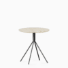 Round terrazzo table with speckled stone top and powdercoated aluminium base.
