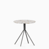 Round terrazzo table with speckled stone top and powdercoated aluminium base.