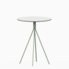 Round compact‑laminate dining table with aluminium base.