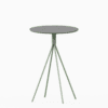 Round terrazzo bar table with speckled stone top and powdercoated aluminium base.